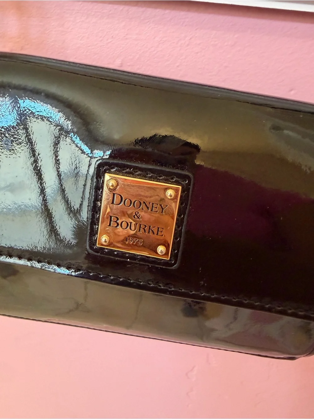 Dooney & Bourke Black Patent Leather Crossbody with Gold Plaque